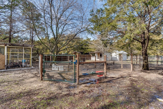 view of yard featuring fence and an outdoor structure