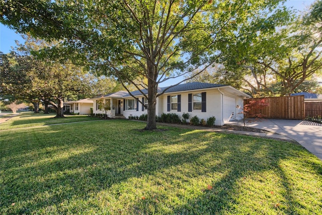 single story home with a garage and a front yard