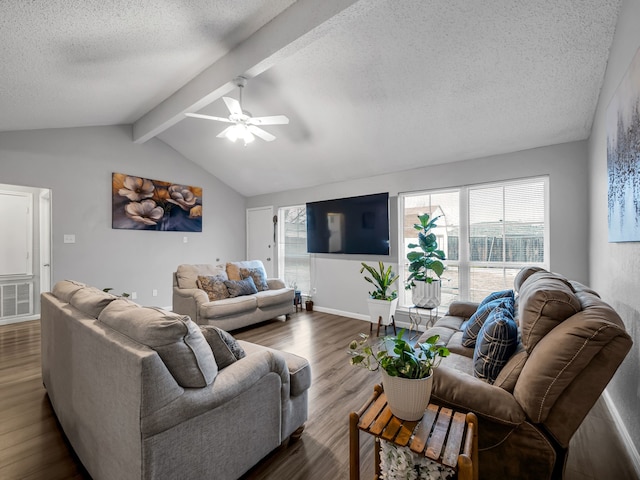 living room with vaulted ceiling with beams, dark hardwood / wood-style floors, a textured ceiling, and ceiling fan