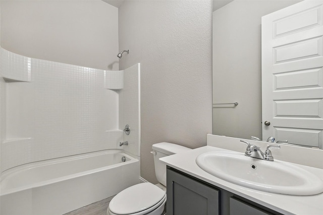 full bathroom with vanity, tub / shower combination, and toilet