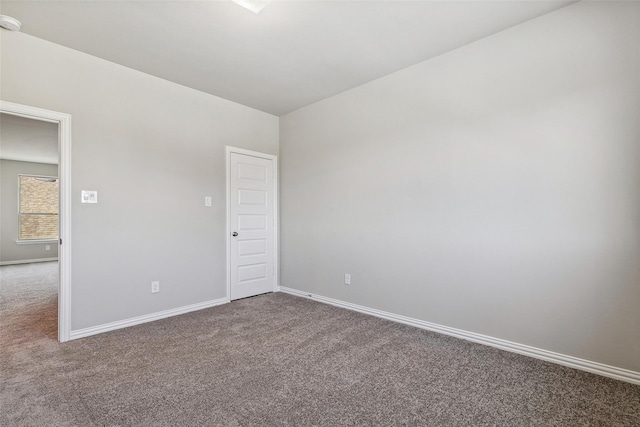 unfurnished room featuring carpet