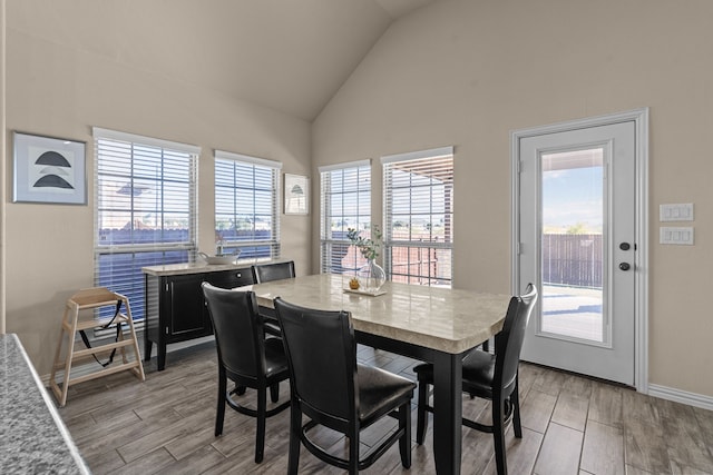 dining area with vaulted ceiling