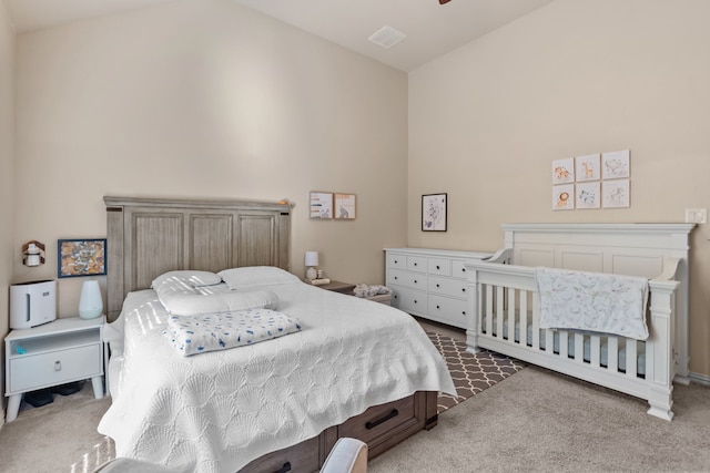 carpeted bedroom with vaulted ceiling