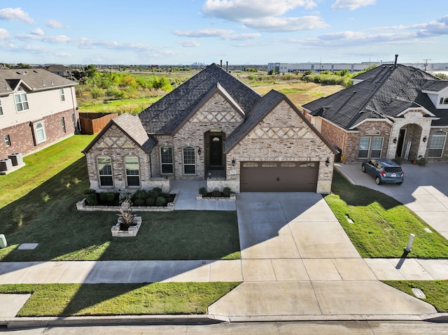 french country style house featuring a front lawn