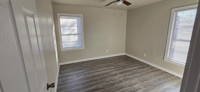 unfurnished room with ceiling fan, dark hardwood / wood-style flooring, and a wealth of natural light