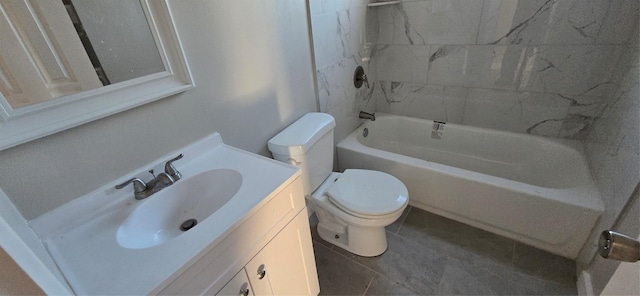 full bathroom featuring tile patterned floors, vanity, toilet, and tiled shower / bath combo