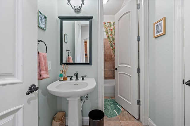 bathroom with tile patterned flooring and sink