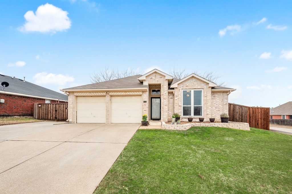 single story home with a garage and a front yard