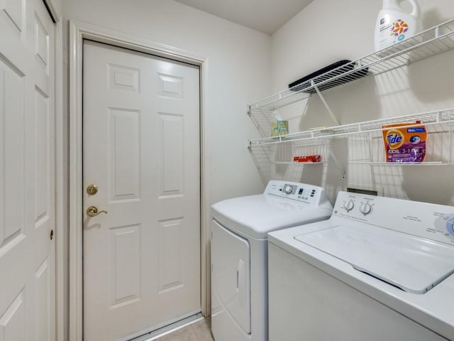 laundry area with separate washer and dryer