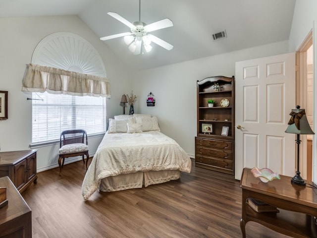 bedroom featuring lofted ceiling, dark hardwood / wood-style floors, and ceiling fan