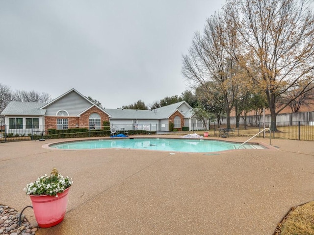 view of pool featuring a patio area