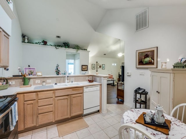 kitchen featuring white dishwasher, light tile patterned floors, sink, and stainless steel electric range oven