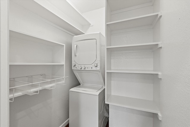 laundry room featuring stacked washer and clothes dryer