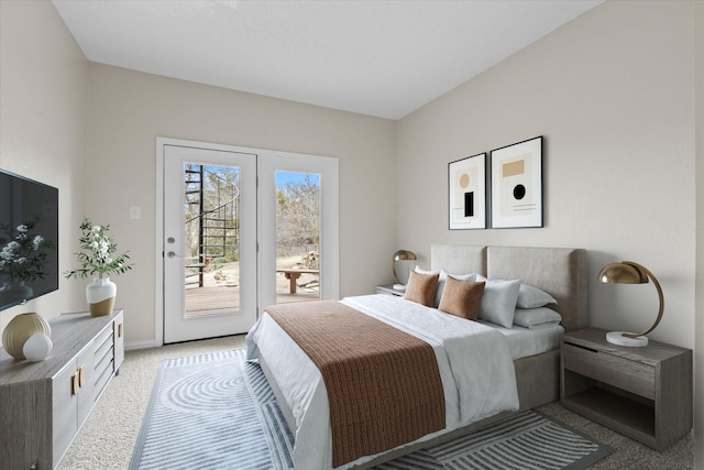 bedroom with light colored carpet and access to outside