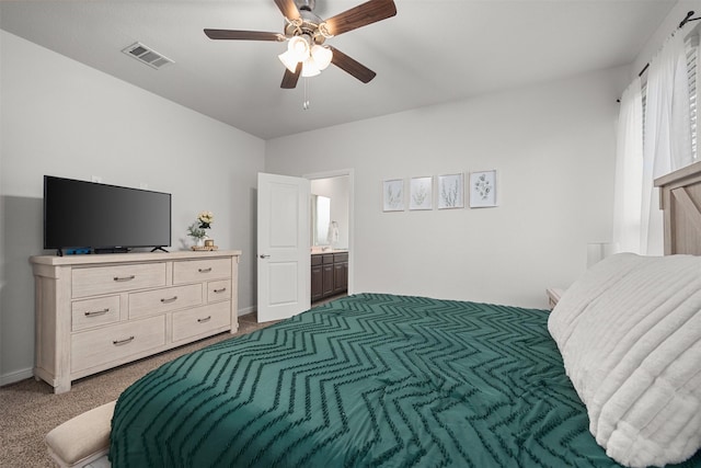 bedroom featuring carpet, connected bathroom, and ceiling fan