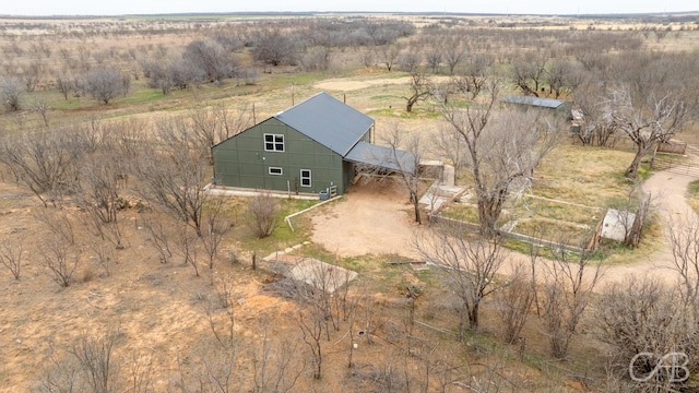 birds eye view of property with a rural view