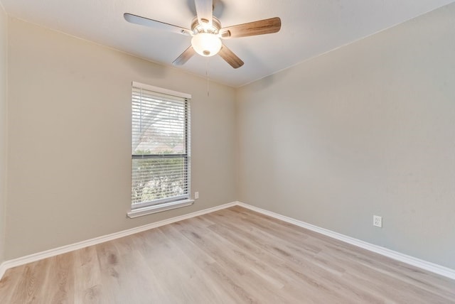 spare room featuring ceiling fan and light wood-type flooring