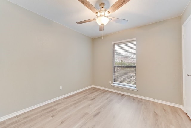 spare room featuring light hardwood / wood-style floors and ceiling fan