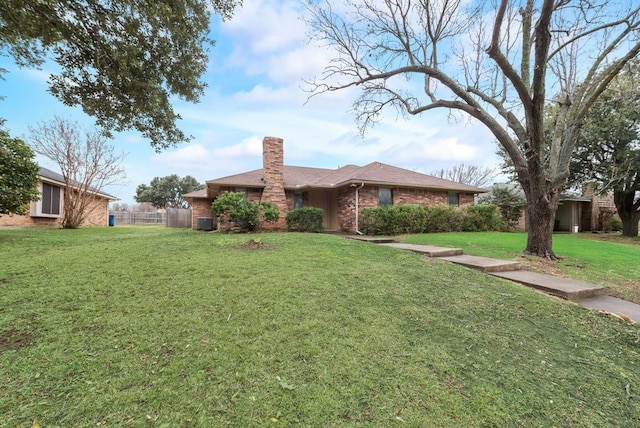 ranch-style home with a front lawn