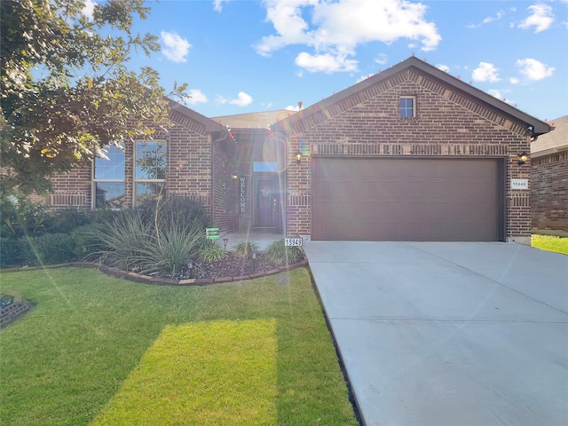 view of front of house with a garage and a front lawn