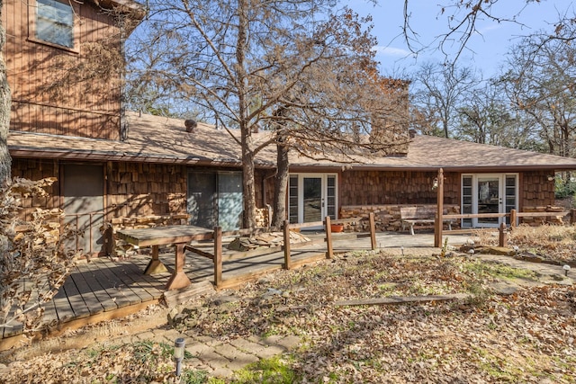 rear view of house with a wooden deck