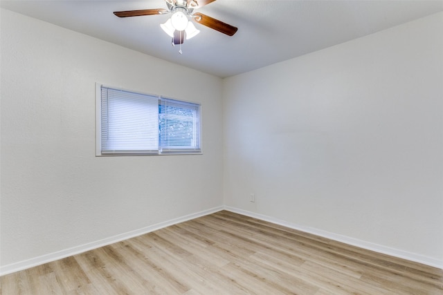 empty room featuring ceiling fan and light hardwood / wood-style floors