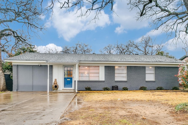 ranch-style home featuring a garage