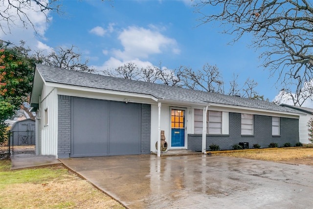 ranch-style home featuring a garage