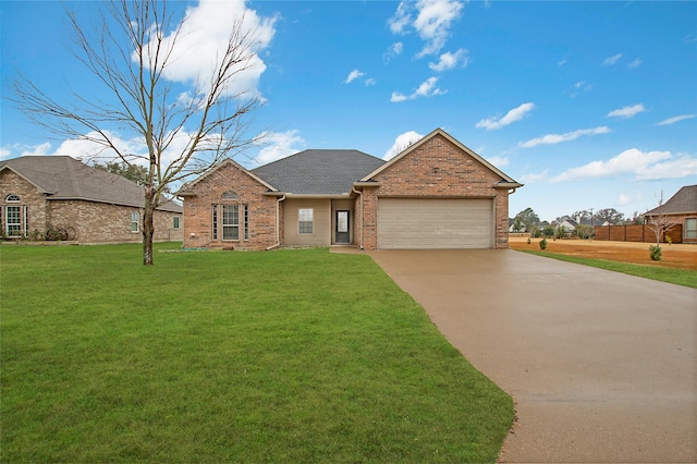 view of front of house with a garage and a front yard