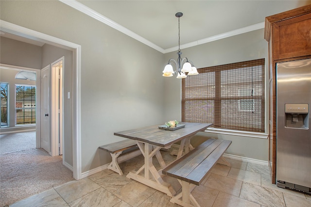 dining area with breakfast area, crown molding, a chandelier, and light carpet