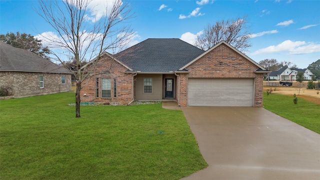 view of front of house featuring a garage and a front yard