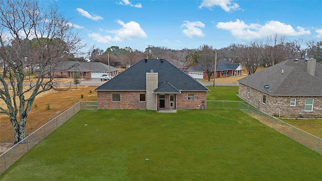 back of house featuring a yard