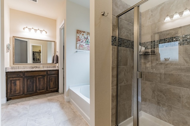 bathroom with shower with separate bathtub and vanity