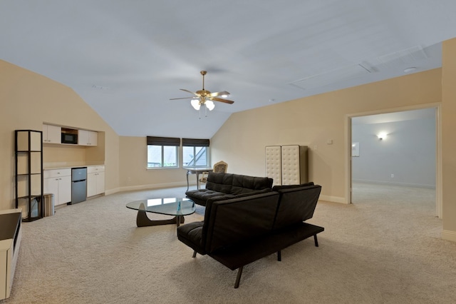 carpeted living room with vaulted ceiling and ceiling fan