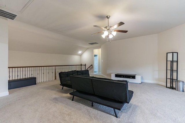 carpeted living room with ceiling fan and lofted ceiling