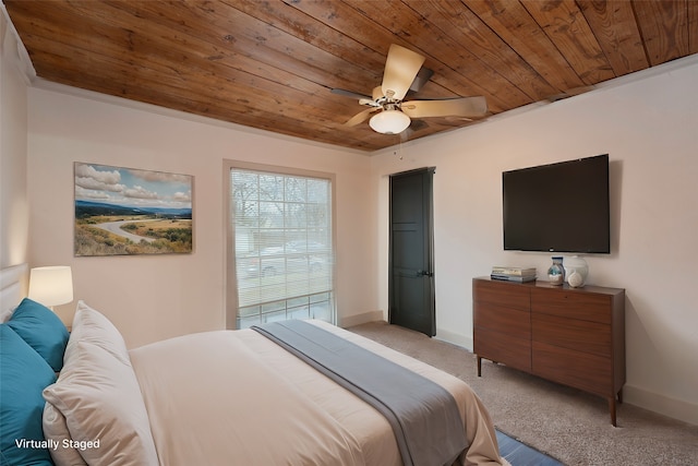 carpeted bedroom with wood ceiling and ceiling fan