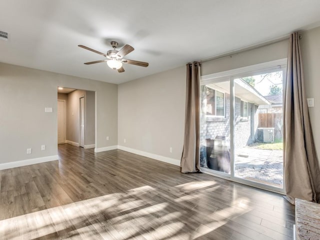 spare room with hardwood / wood-style flooring and ceiling fan