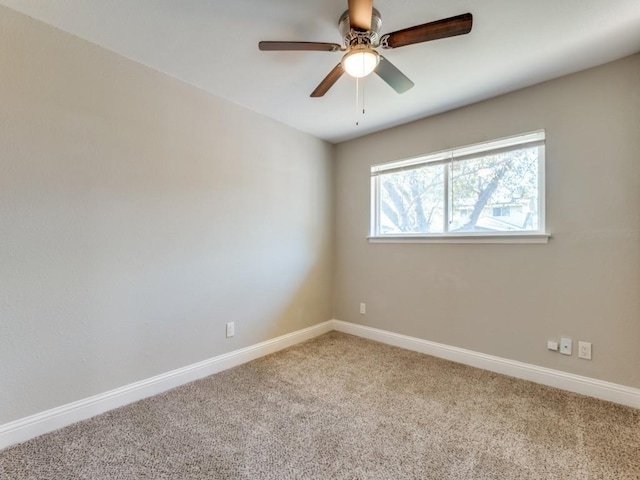 unfurnished room with carpet flooring and ceiling fan