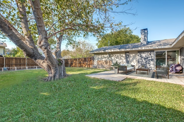 view of yard with an outdoor living space and a patio area