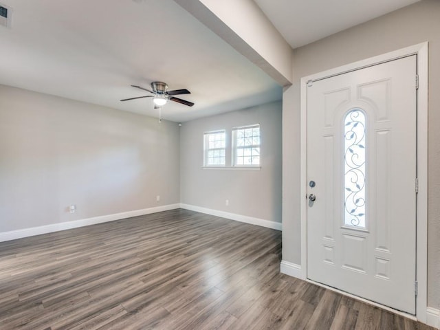 entryway with dark hardwood / wood-style floors and ceiling fan