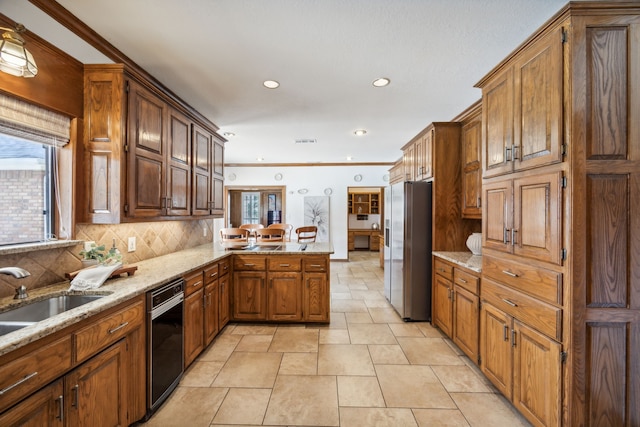 kitchen with sink, stainless steel fridge, ornamental molding, decorative backsplash, and kitchen peninsula