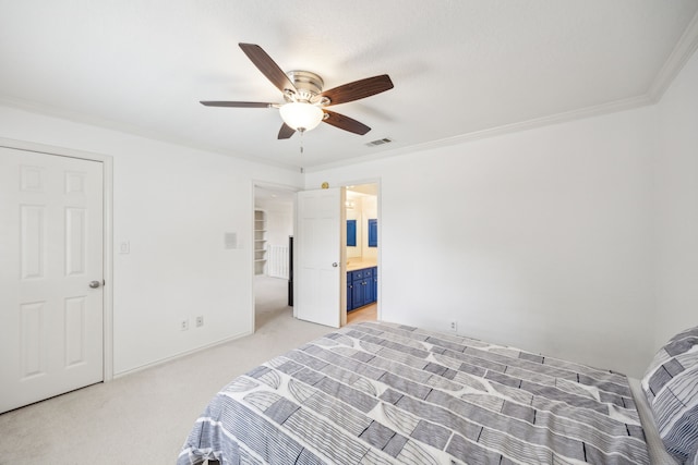 carpeted bedroom featuring crown molding, connected bathroom, and ceiling fan