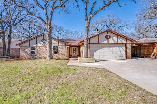 view of front of home with a garage and a front yard