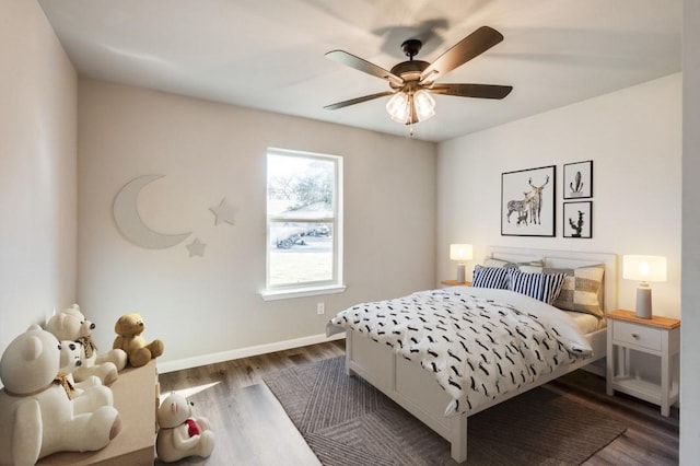 bedroom featuring ceiling fan and dark hardwood / wood-style flooring