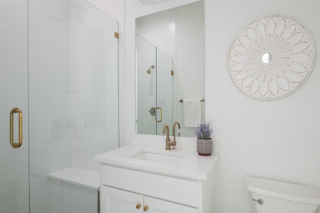 bathroom with vanity, toilet, and walk in shower