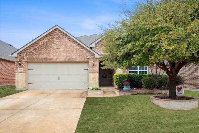 view of front of property featuring a garage and a front yard