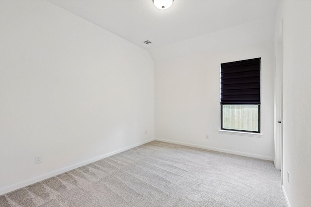 unfurnished room with light carpet