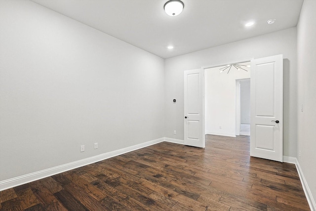 unfurnished bedroom with dark hardwood / wood-style floors