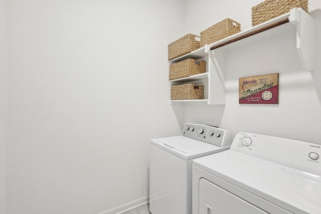 washroom featuring washing machine and dryer