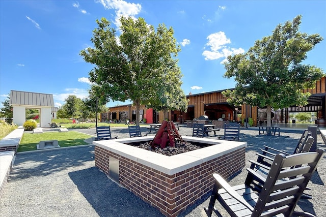 view of patio / terrace featuring an outdoor fire pit